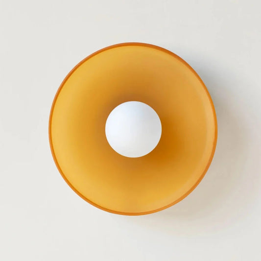 Nordic round wall sconce with amber glass