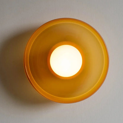 Round Scandinavian wall light with amber shade