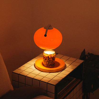 The Solange - Lucy’s Lamps is a modern orange glass table lamp with candle warmer lamp functionality. Aesthetic retro stained glass lamp ideal as a bedside table lamp, small desk lamp, or minimalist side table lamp. Perfect for bedroom table lamps or modern lamp for living room styling. Explore Lucys Lamps for more home lighting ideas.